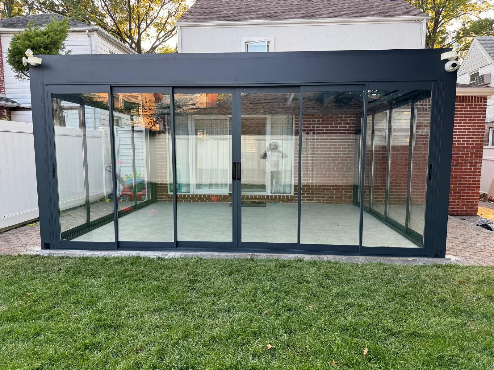 Panora sunroom exterior with sliding glass walls