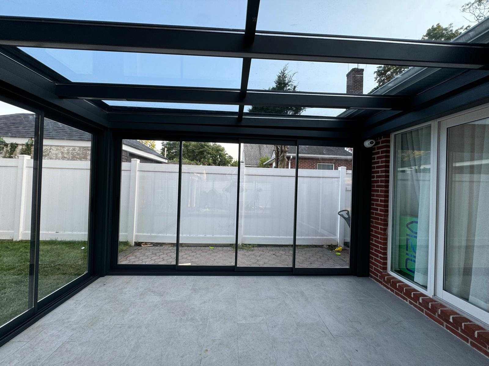 Panora sunroom interior view toward the house