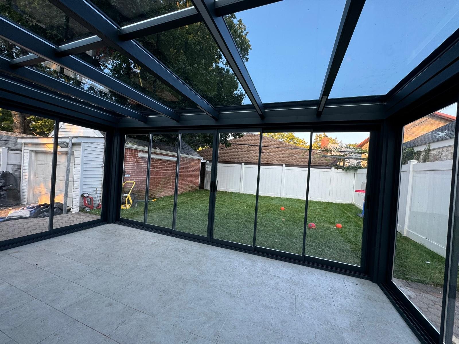 Panora sunroom interior corner view at dusk