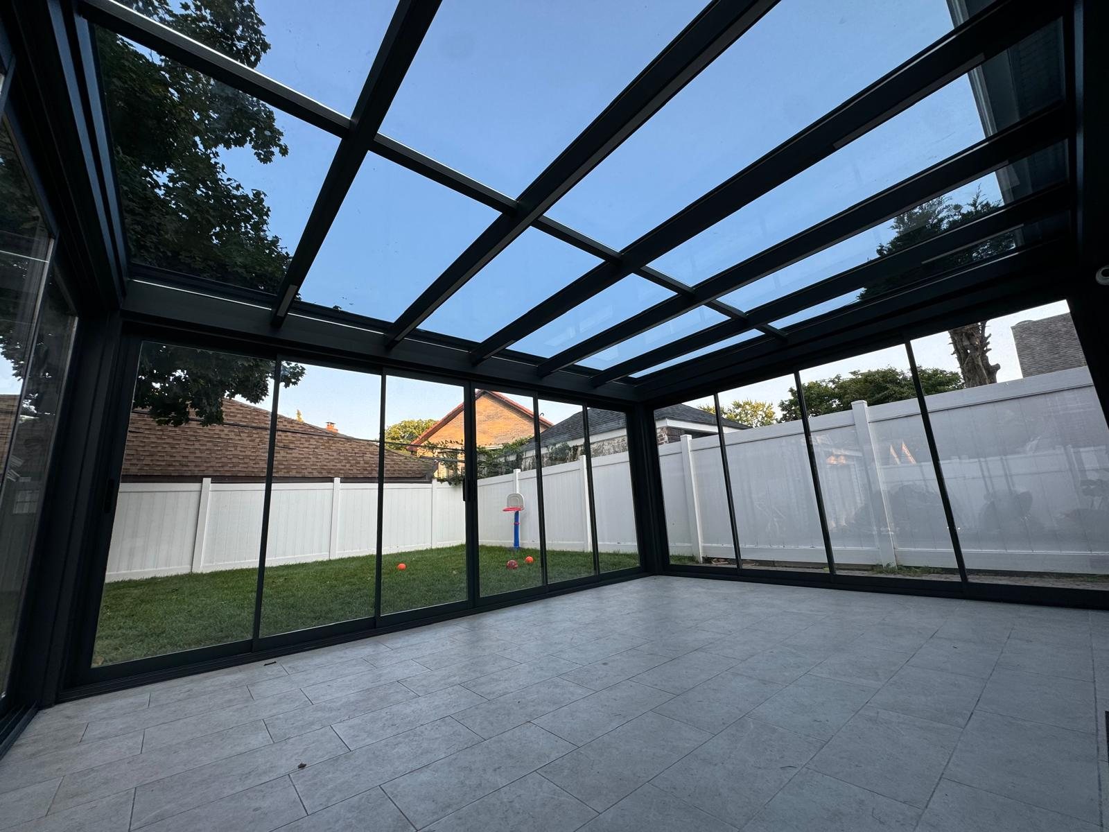 Panora sunroom interior view of the backyard